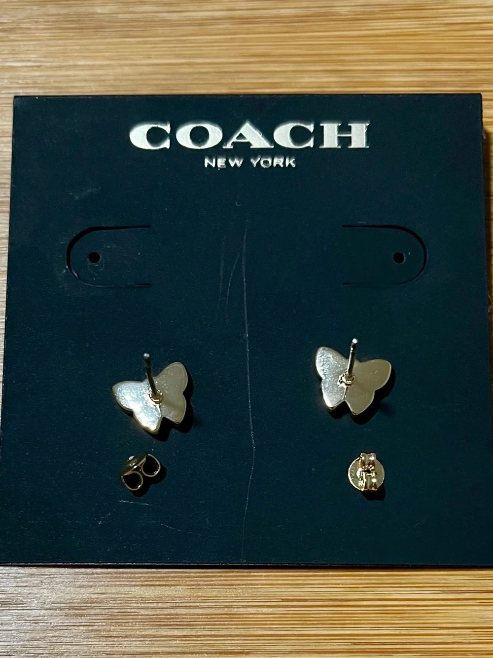Coach Signature Butterfly Stud Earrings Gold Tone White Enamel & Crystal Accents